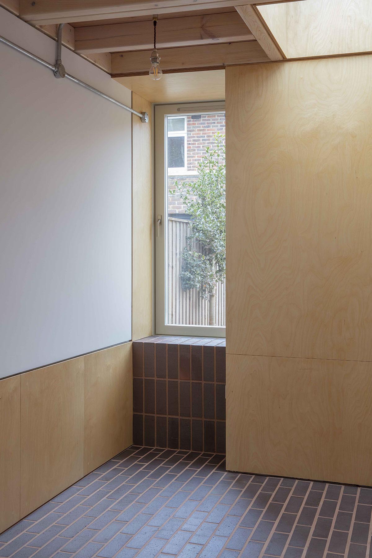 brown brindle brick sized quarry tiles and brown brindle bricks on a residential refurb project by Sanya Polescuk Architects